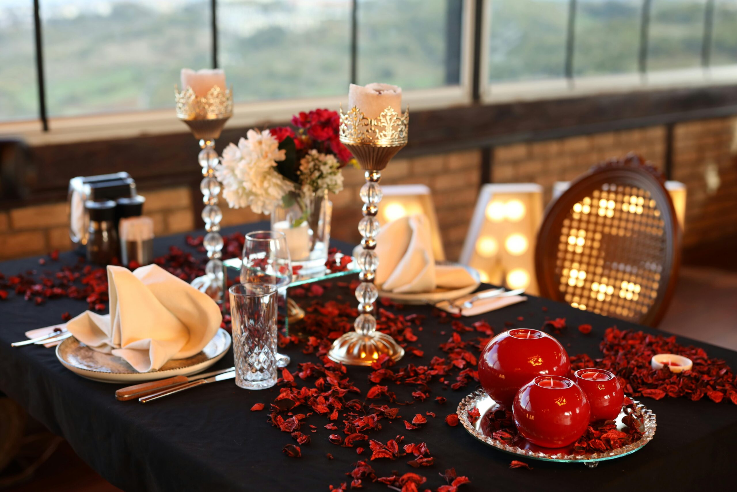 couple enjoying candlelight dinner in luxury hotel with fine dining romantic setup